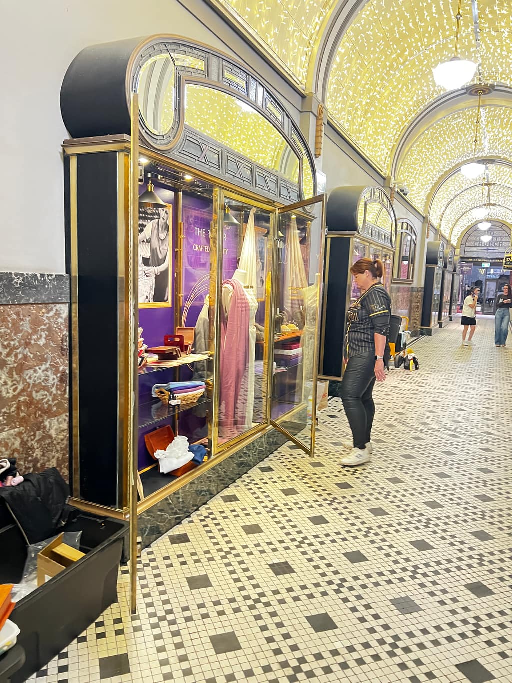 Side view of Trinity Arcade tailor installation within the arcade environment